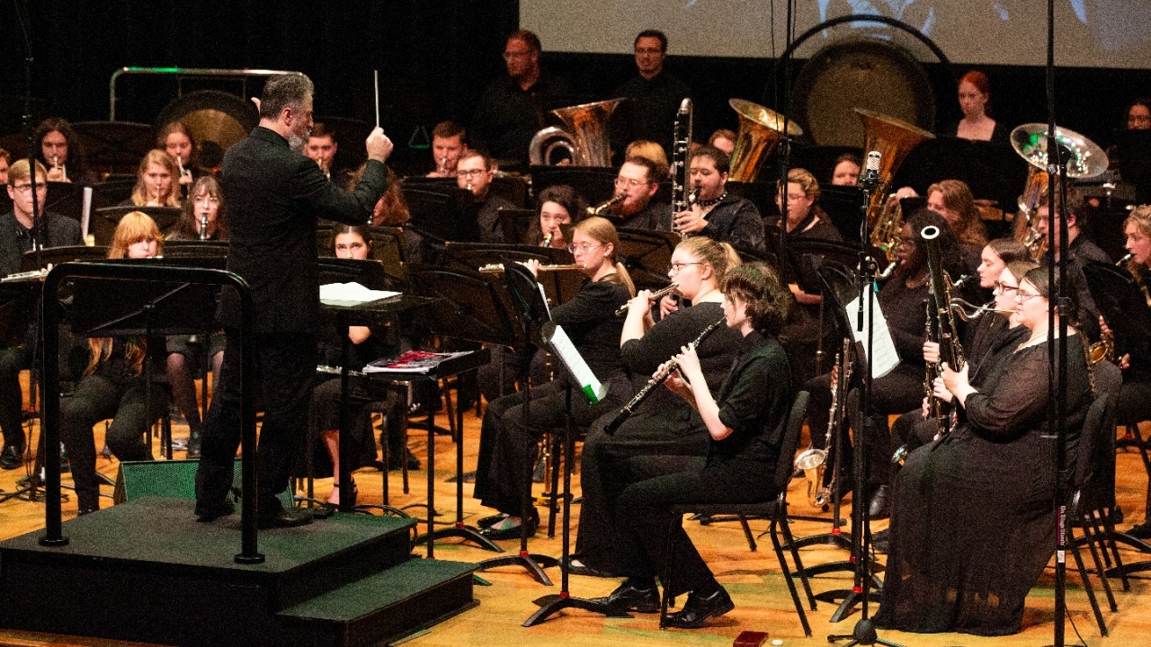 Wind band performing on stage